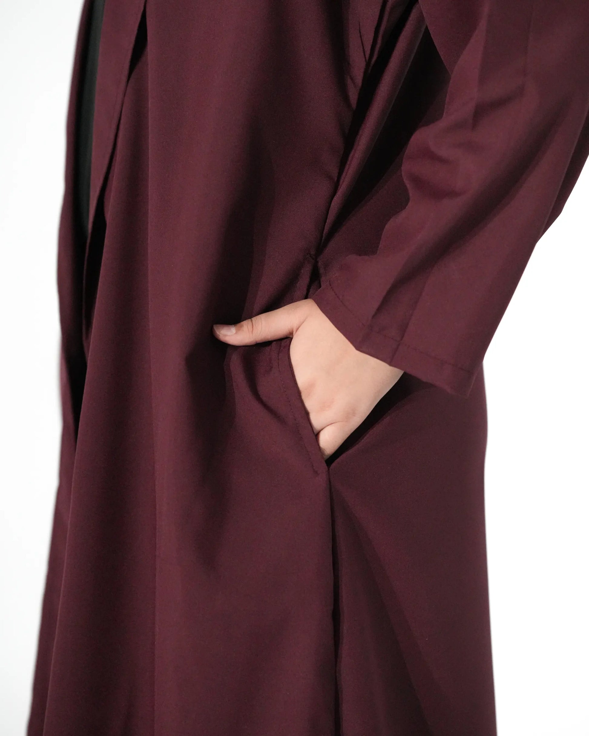 Pocket detail close up of maroon open front abaya