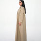 Side profile of beige open abaya with structured modest silhouette