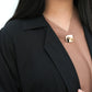Close up showing the structured collar and clean neckline finish.