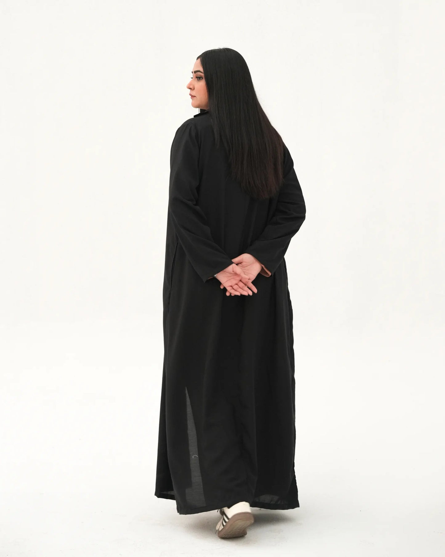 ack view of black long coat abaya with structured modestwear design