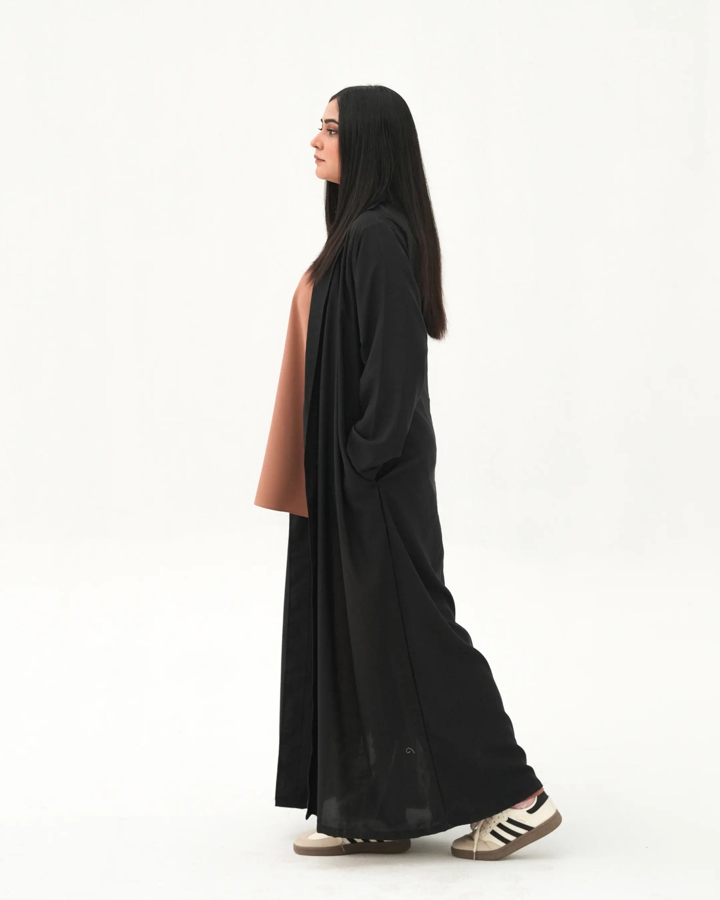 Side profile of black open front abaya with modest full length drape