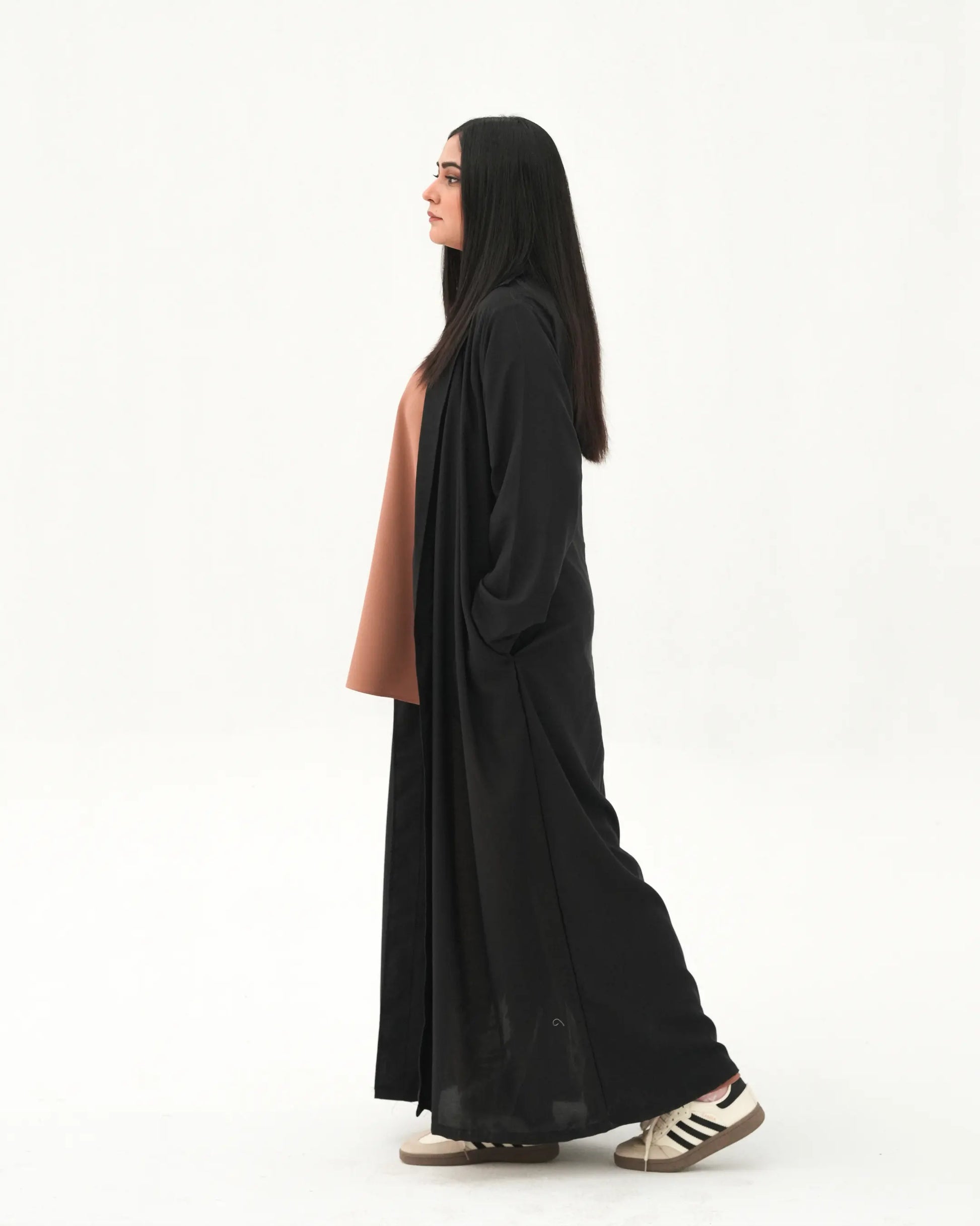 Side profile of black open front abaya with modest full length drape
